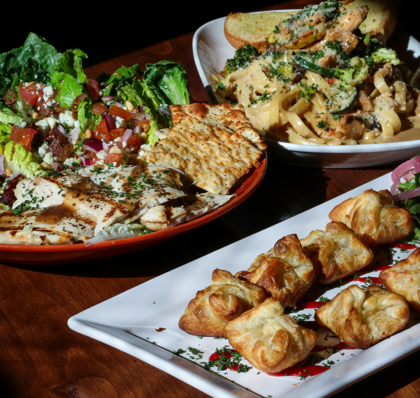 Smoky Mountain's Hearts on Fire Salad, Teriyaki Chicken Fettuccine, and Brie Kisses appetizer