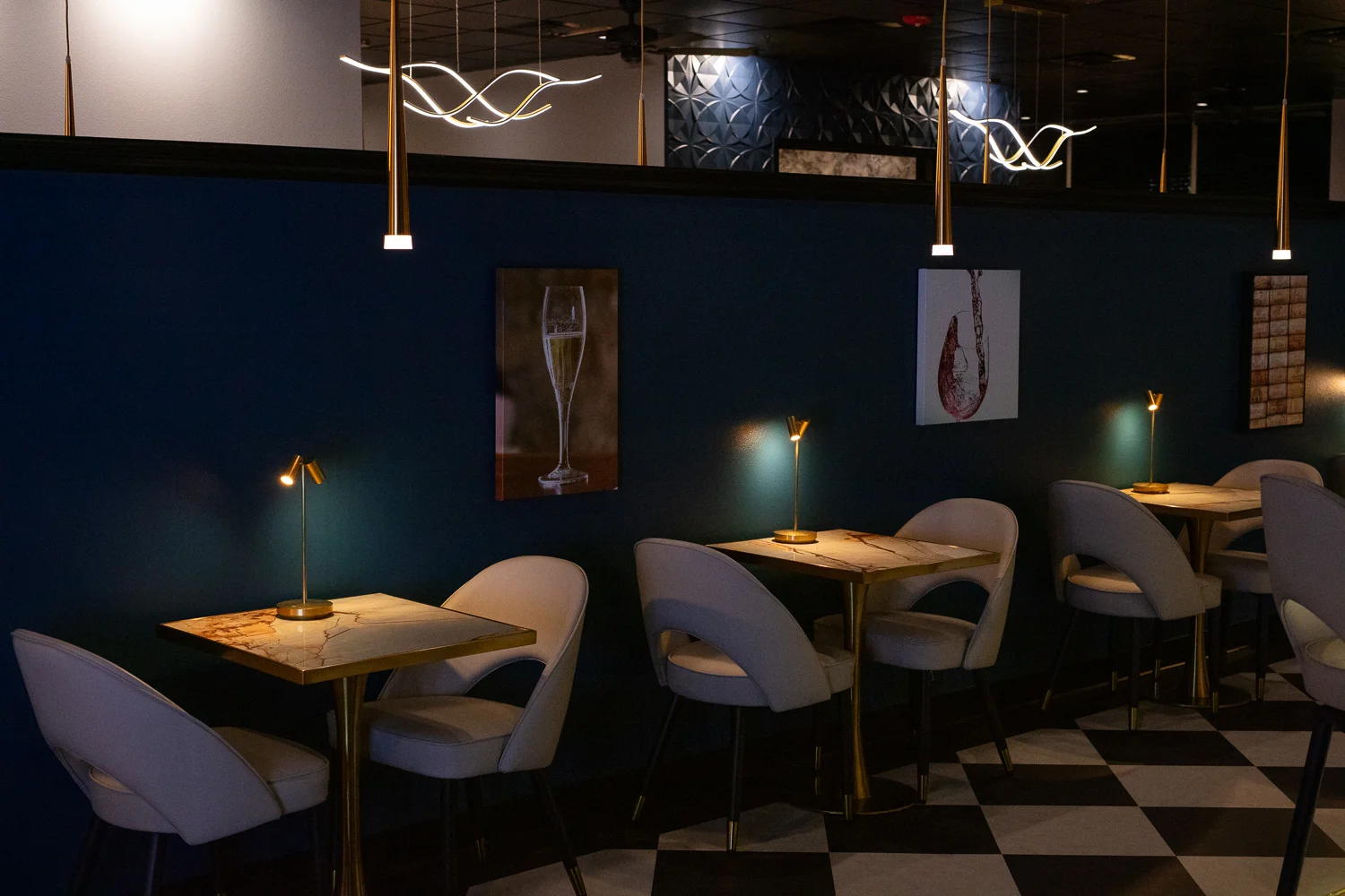Tables in Isabella's Italian with beautiful lighting and thoughtful details