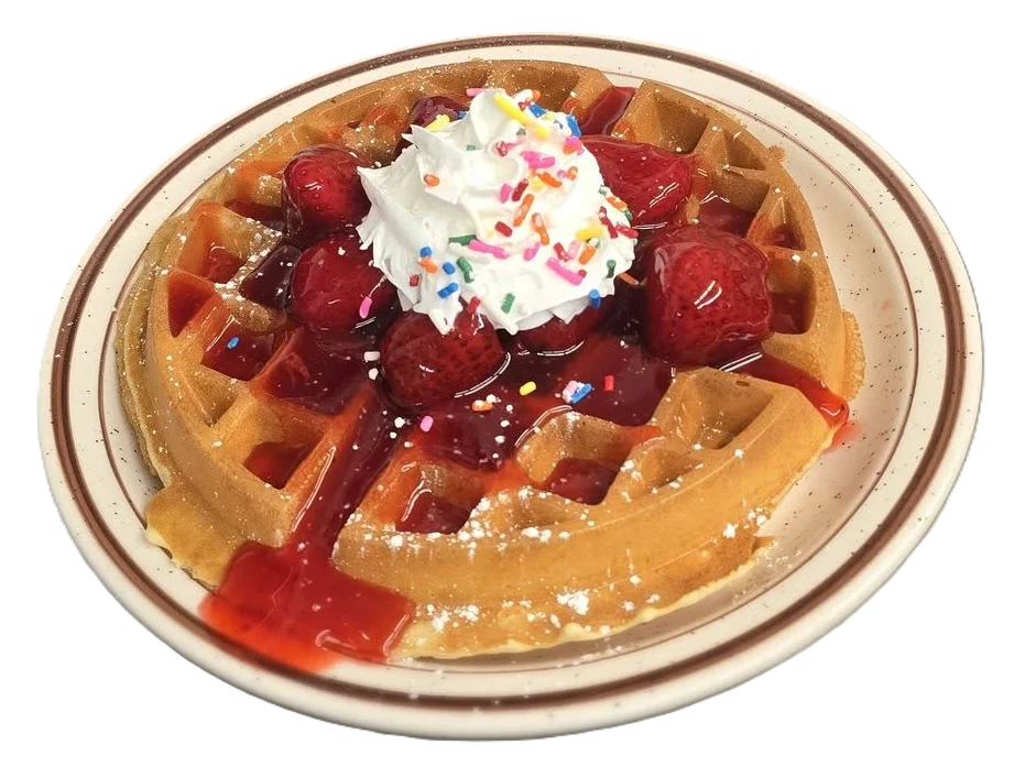 Delicious Belgian waffle topped with strawberries and whipped cream