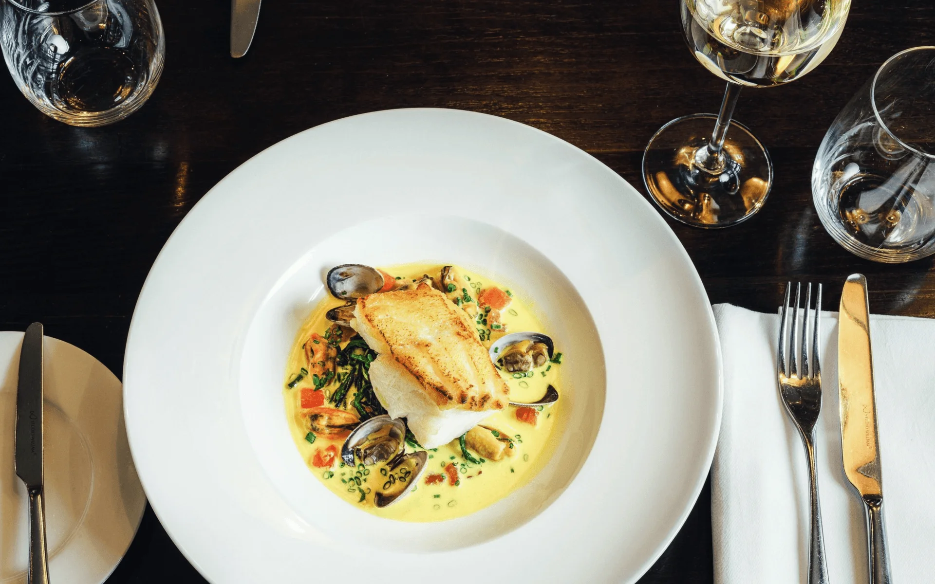 Pan-seared cod in a creamy seafood sauce
