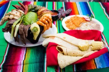 Mexican parrillada with assorted grilled meats and vegetables