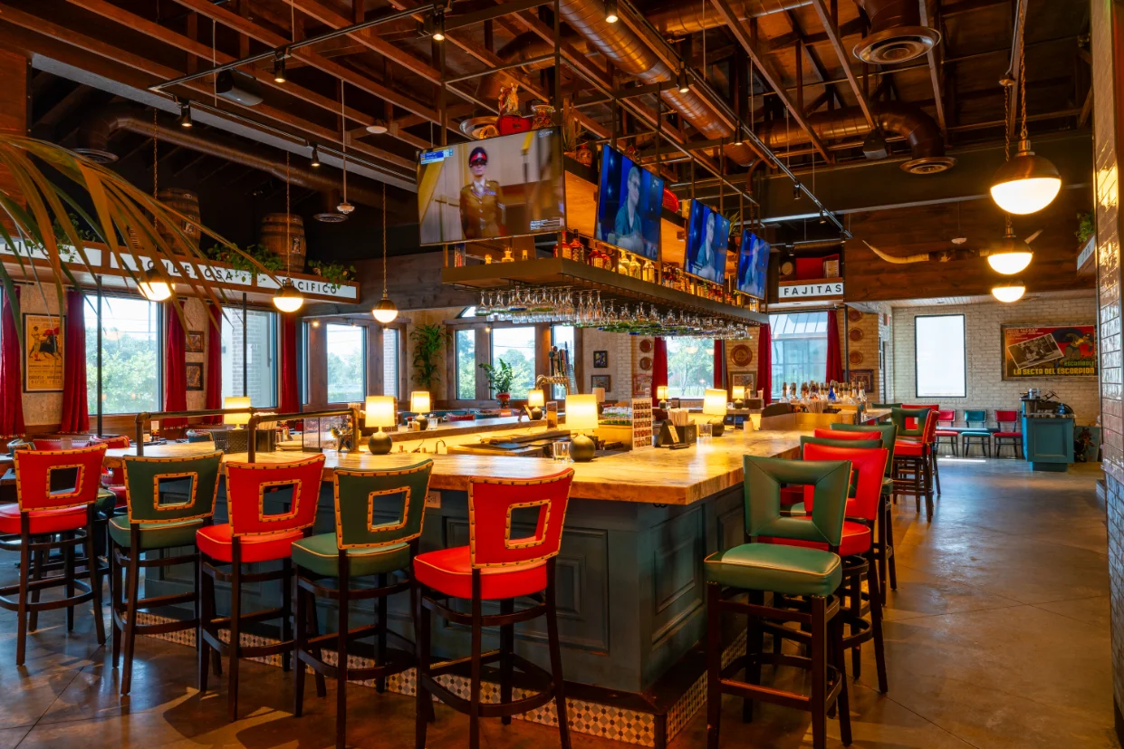 Vibrant restaurant bar with colorful seating and modern decor