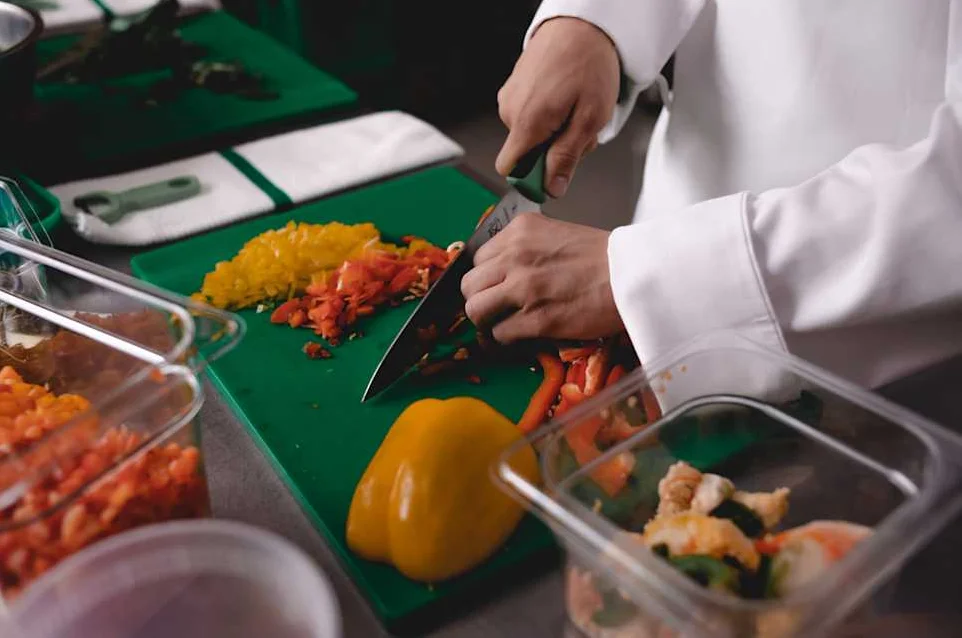 Chef preparing fresh vegetables for a culinary dish