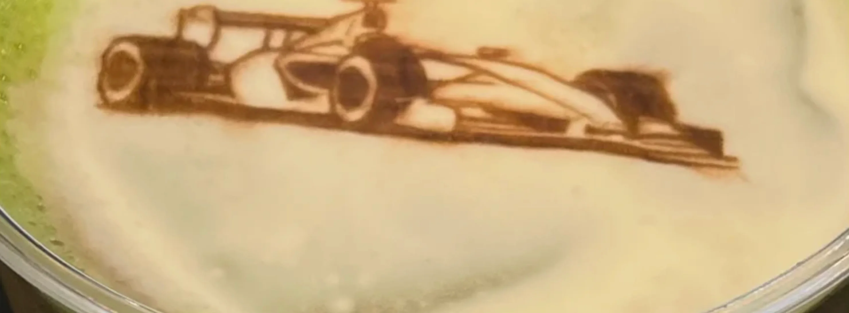 Latte art featuring a racing car design