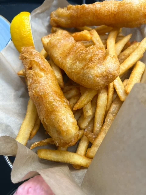 Crispy fish and chips served with golden fries