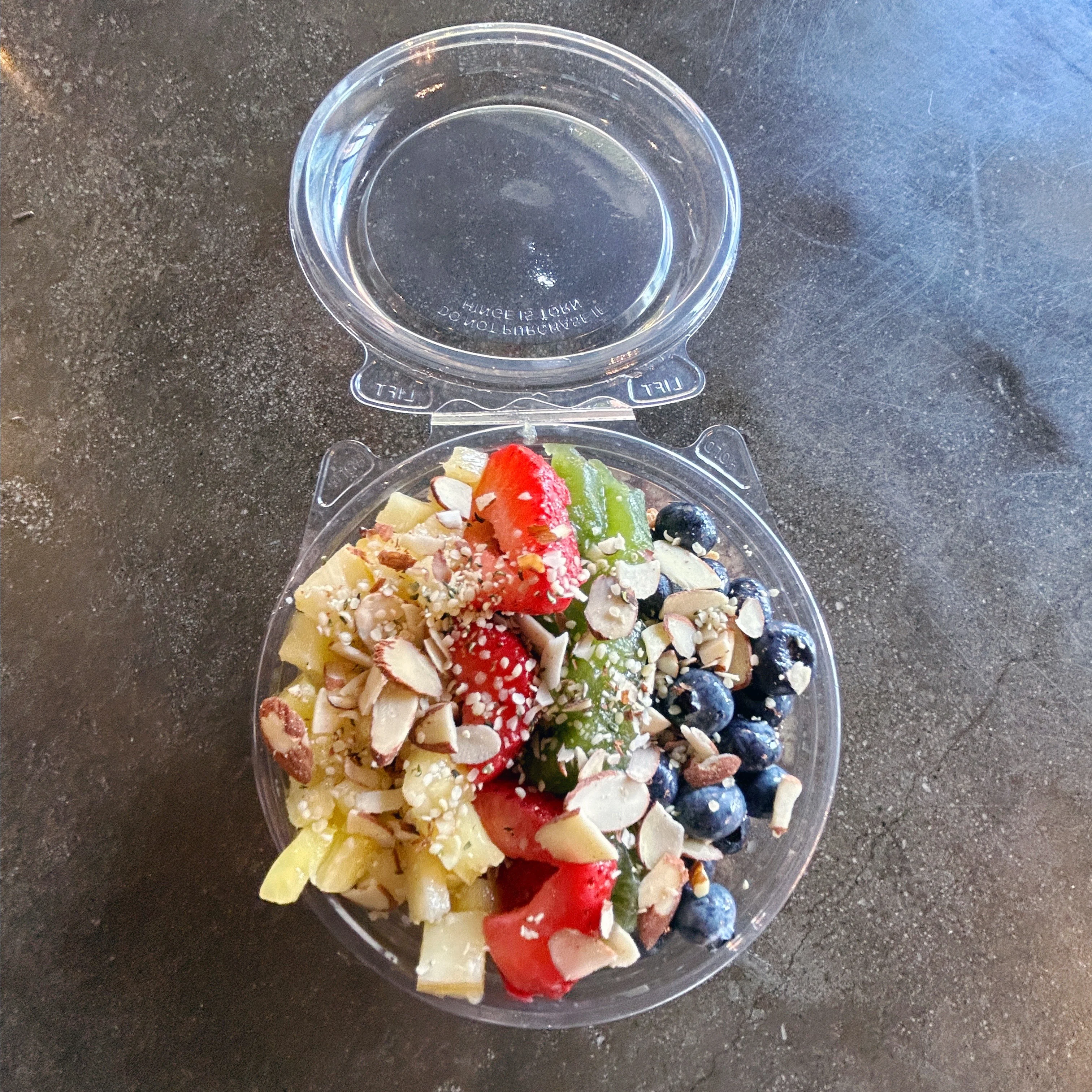 Colorful fruit salad in a clear container
