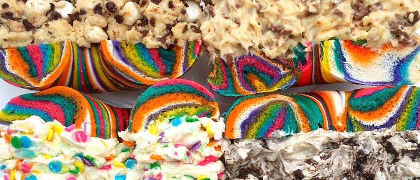Colorful rainbow bagels with cream cheese toppings