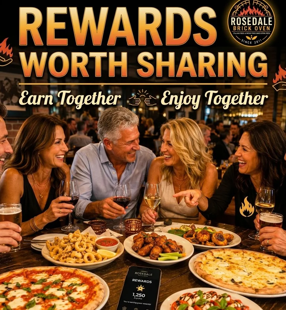 Group enjoying Italian cuisine with pizza and appetizers at a restaurant