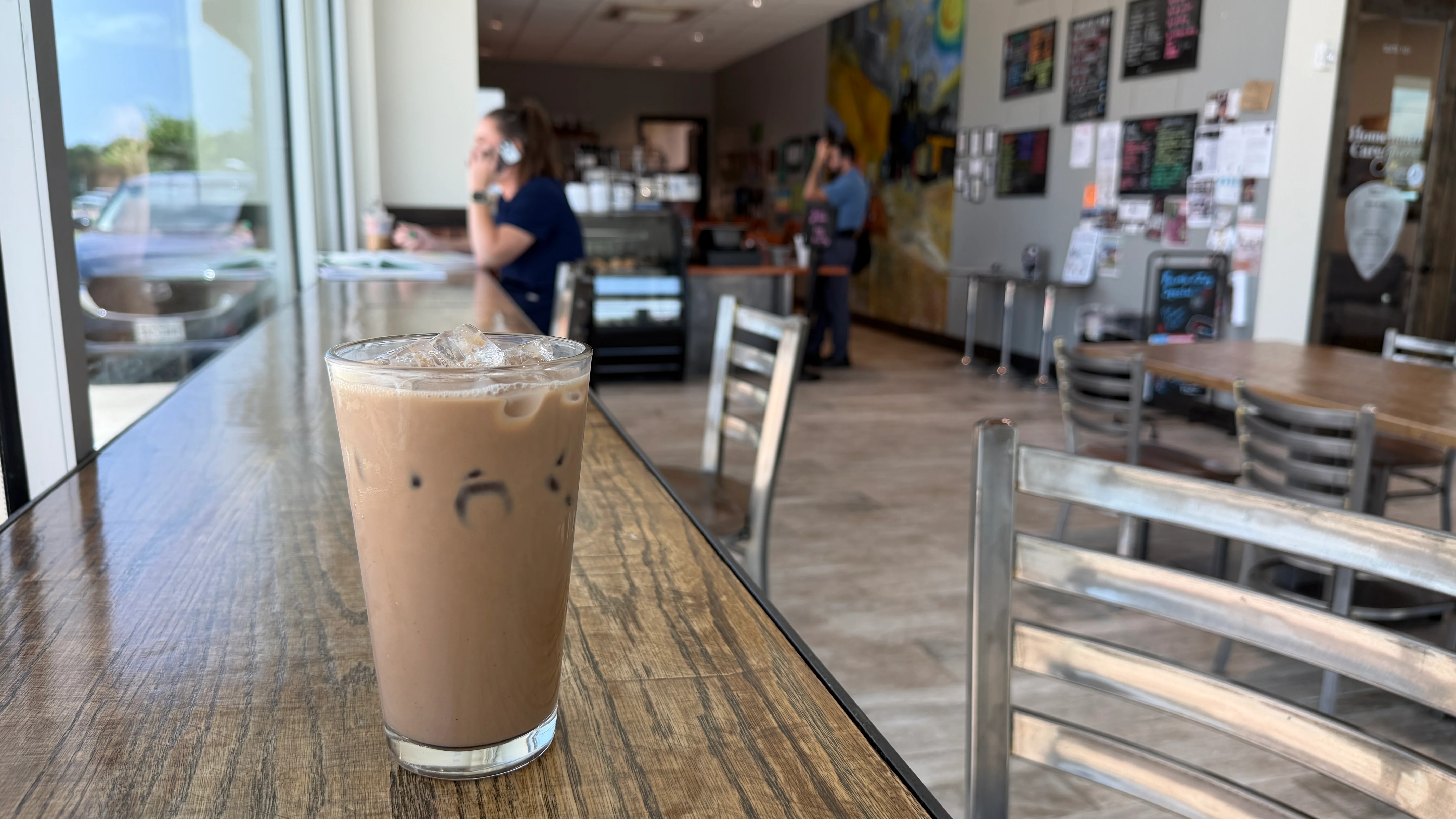 Iced coffee drink in a cozy café setting