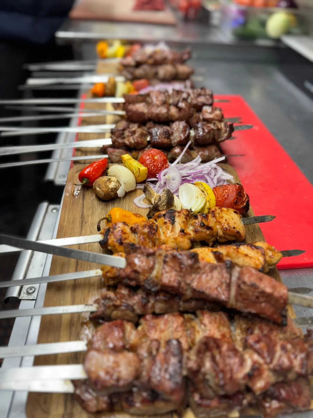 Traditional Uzbek mixed grill skewers representing authentic cultural dining at Samarkand Nights Brooklyn