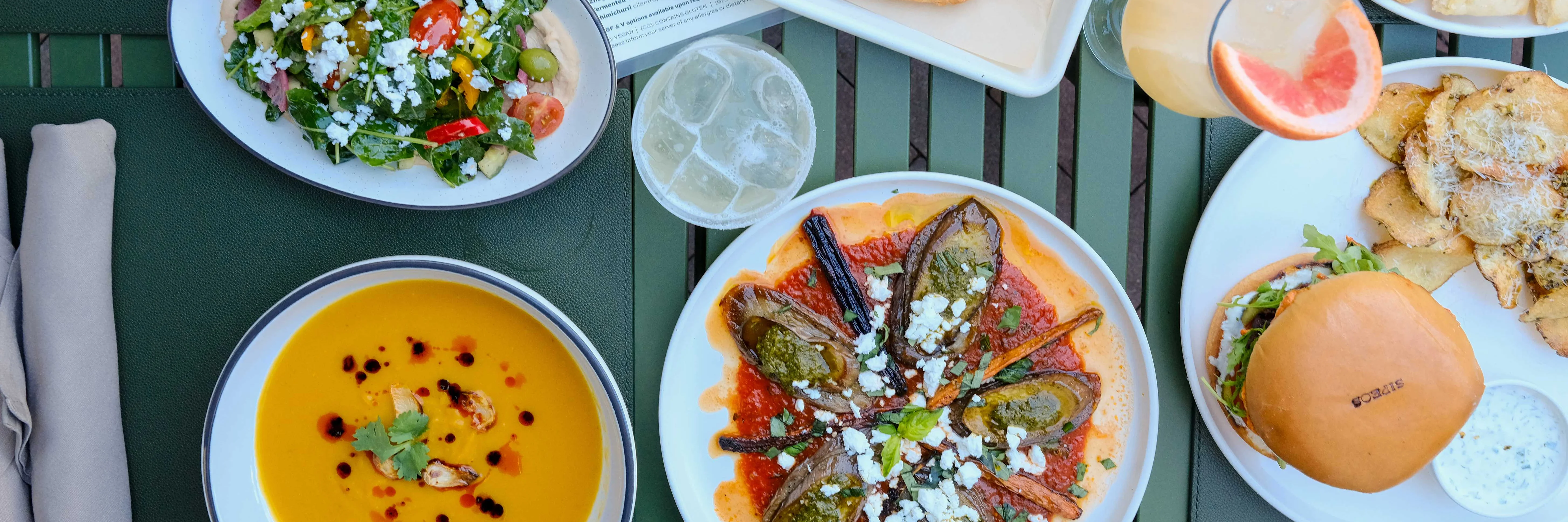 Outdoor dining setup with delicious food and vibrant atmosphere.