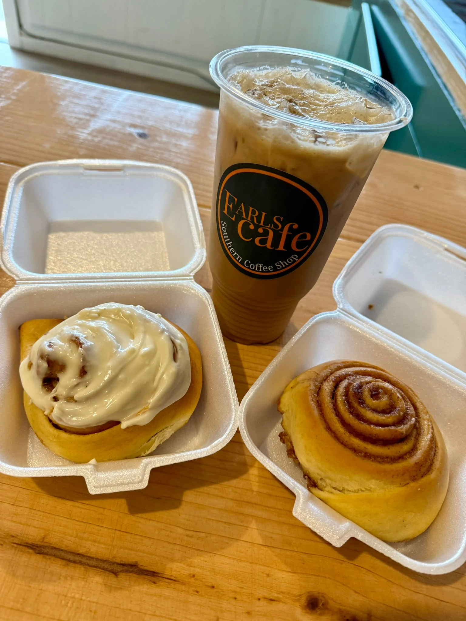 Freshly baked cinnamon rolls with iced coffee