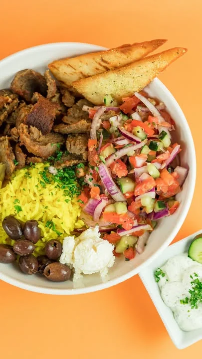 Greek bowl with gyro meat fresh vegetables and feta from Santorini's near Kaysville and Layton