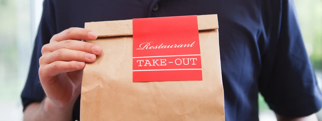 Take-out bag from a restaurant with a red label