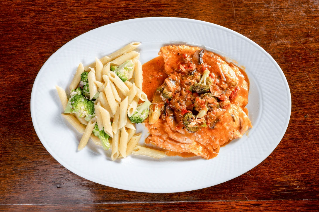 Italian chicken piccata with penne pasta and broccoli