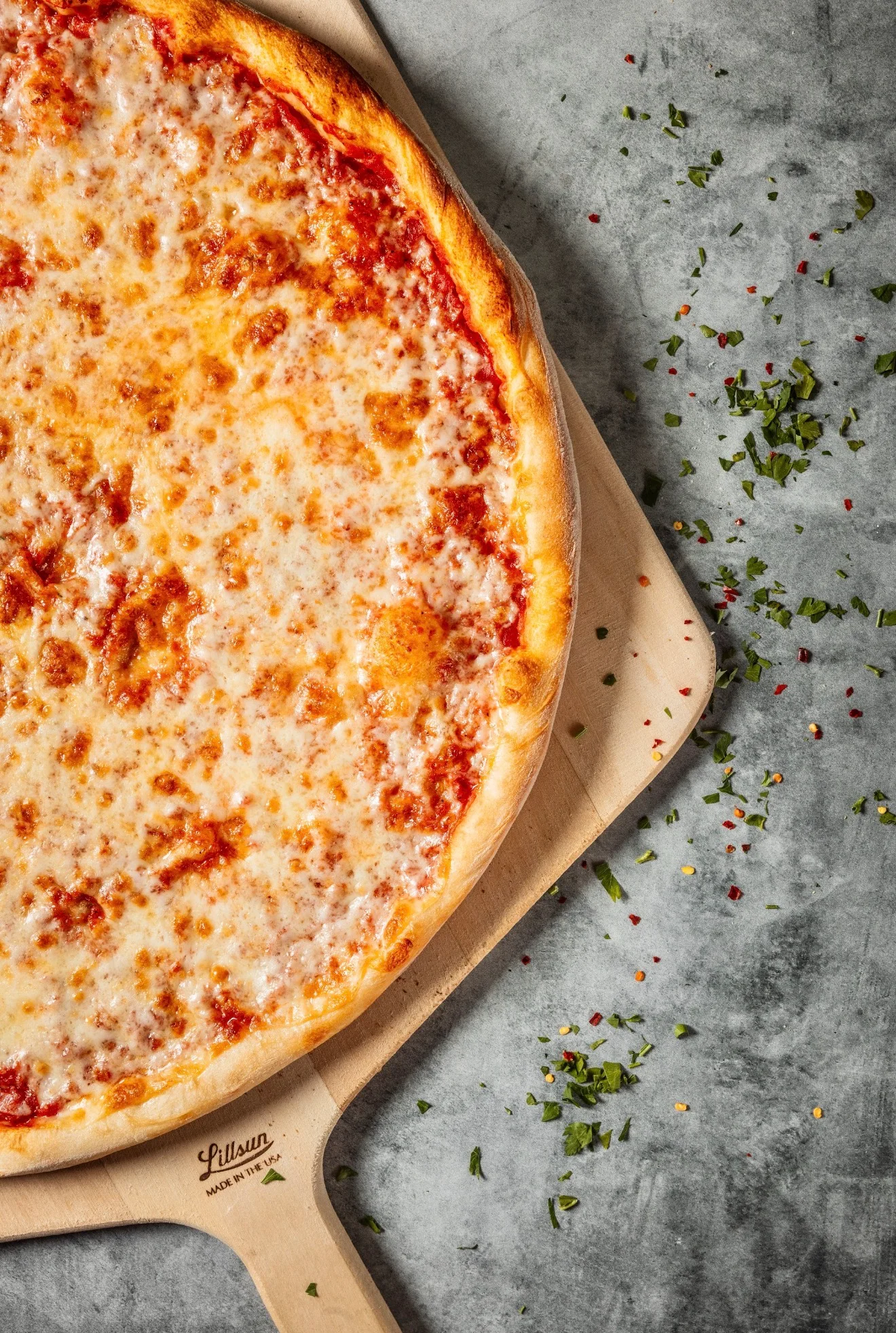 Classic New York–style cheese pizza