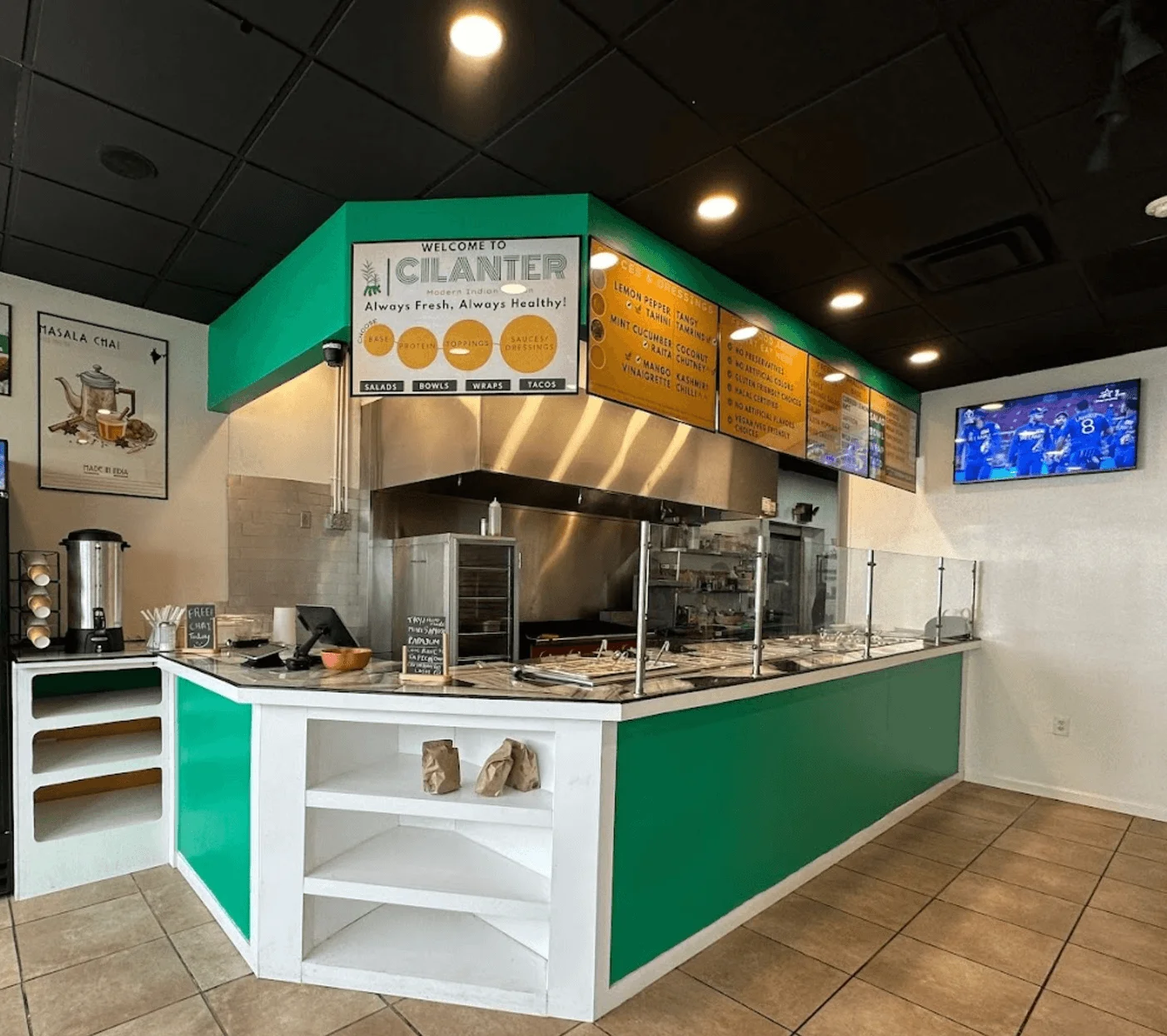 Modern restaurant interior with vibrant decor and open kitchen