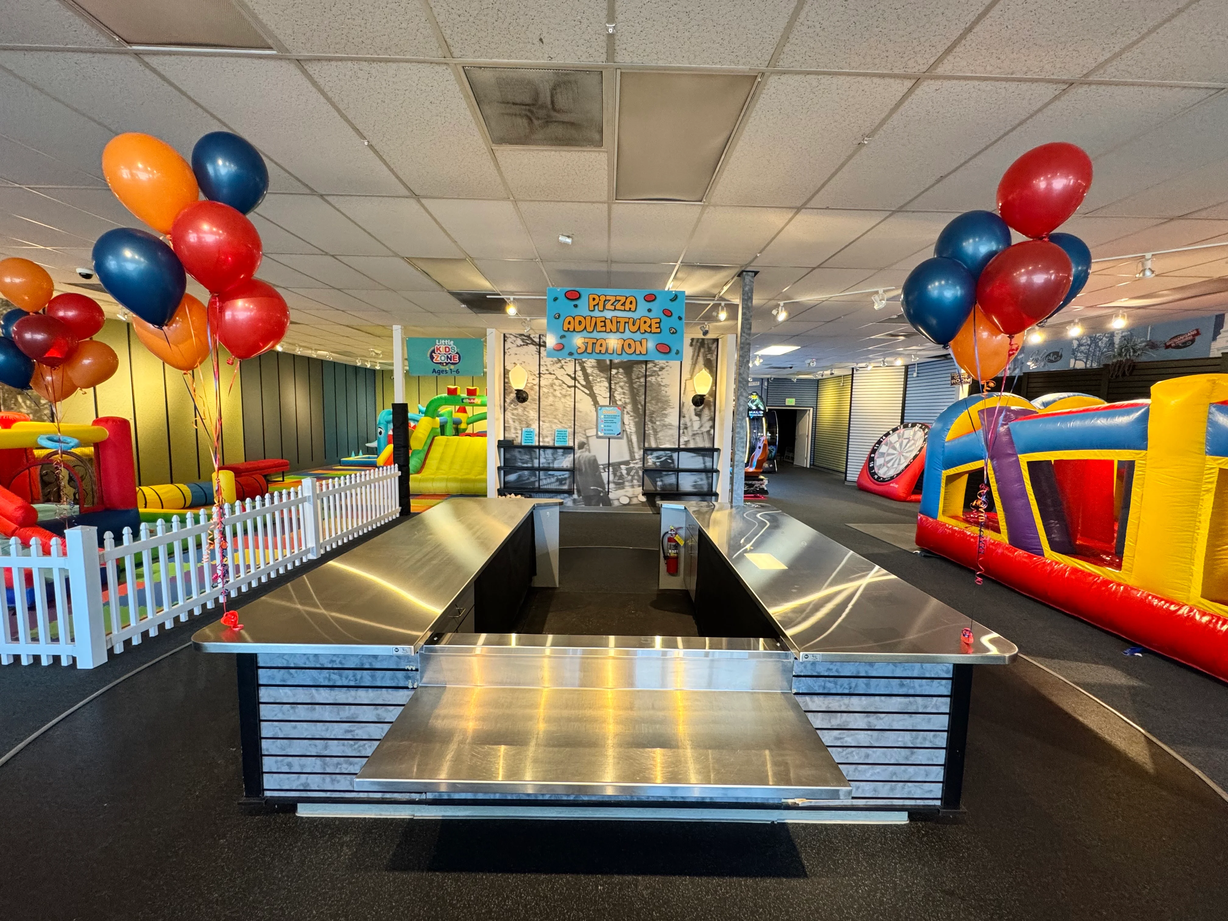 Colorful kids' play area with inflatable attractions and party decorations