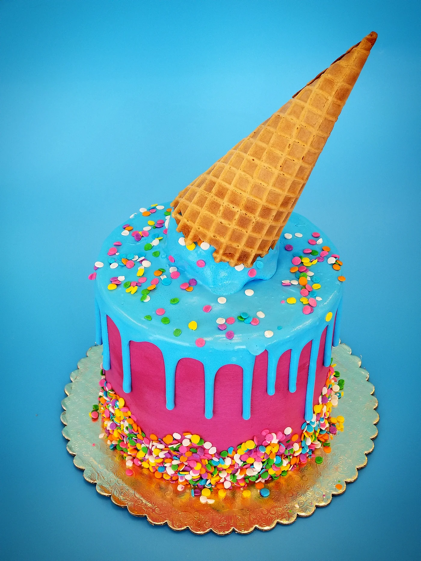Colorful ice cream cake with cone and sprinkles