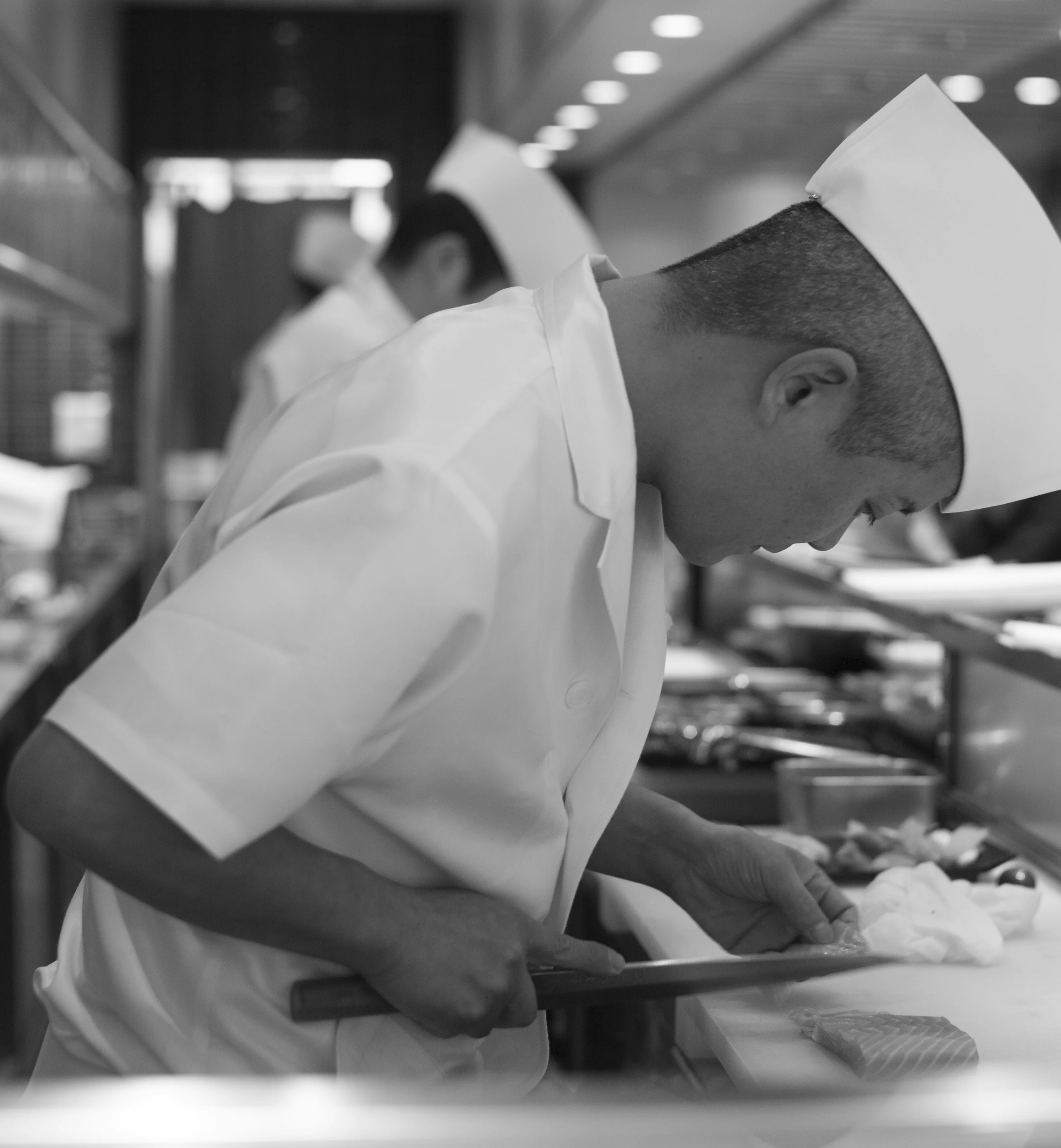 A restaurant chef preparing a dish