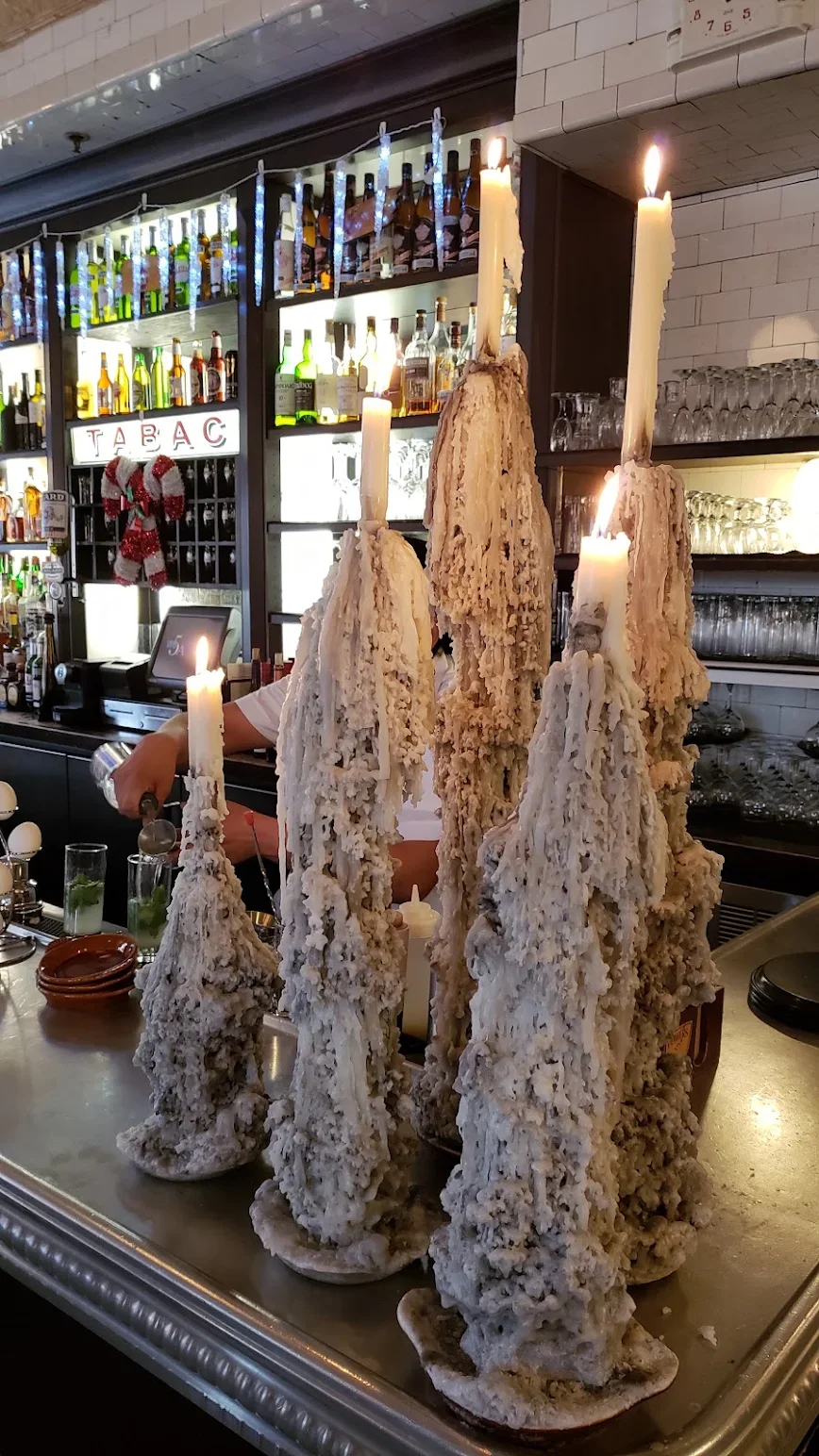 Unique candle display at a modern bar with artistic wax formations