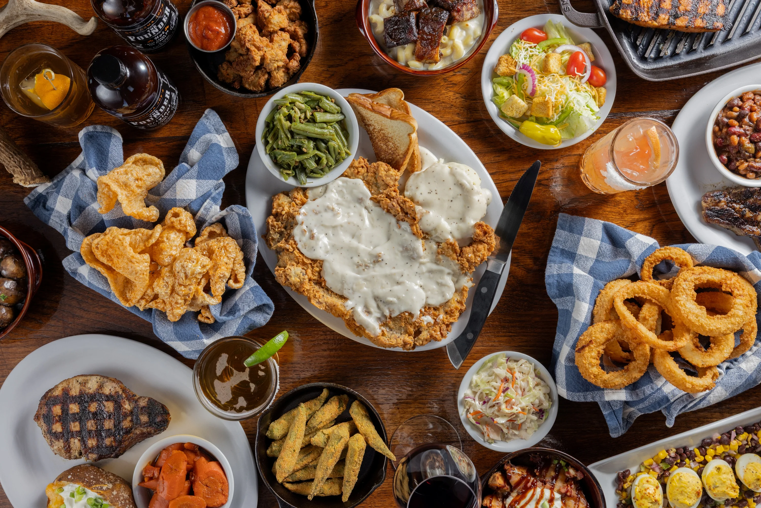 A variety of Southern comfort foods on a wooden table.
