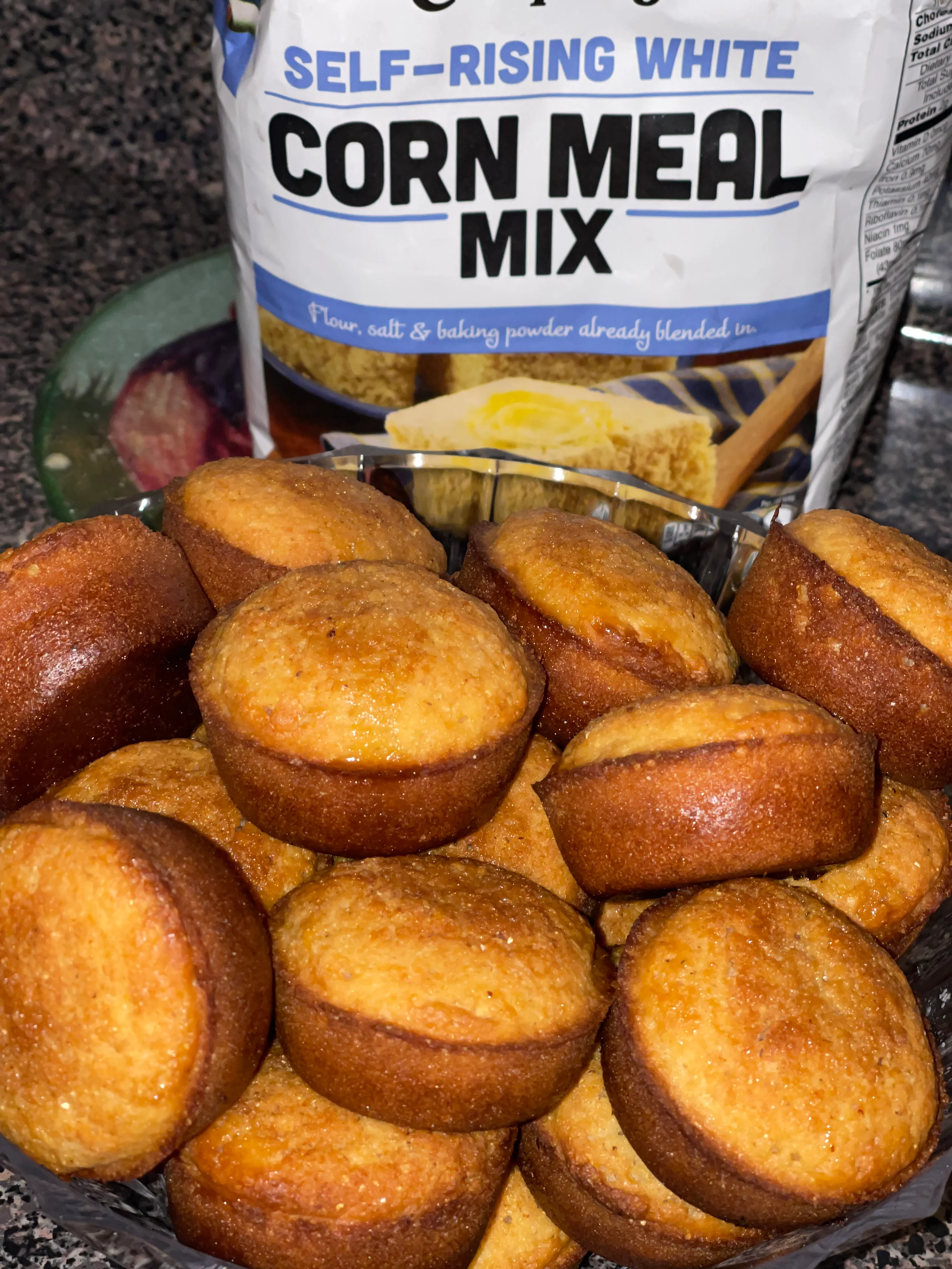Freshly baked cornbread muffins in a serving dish