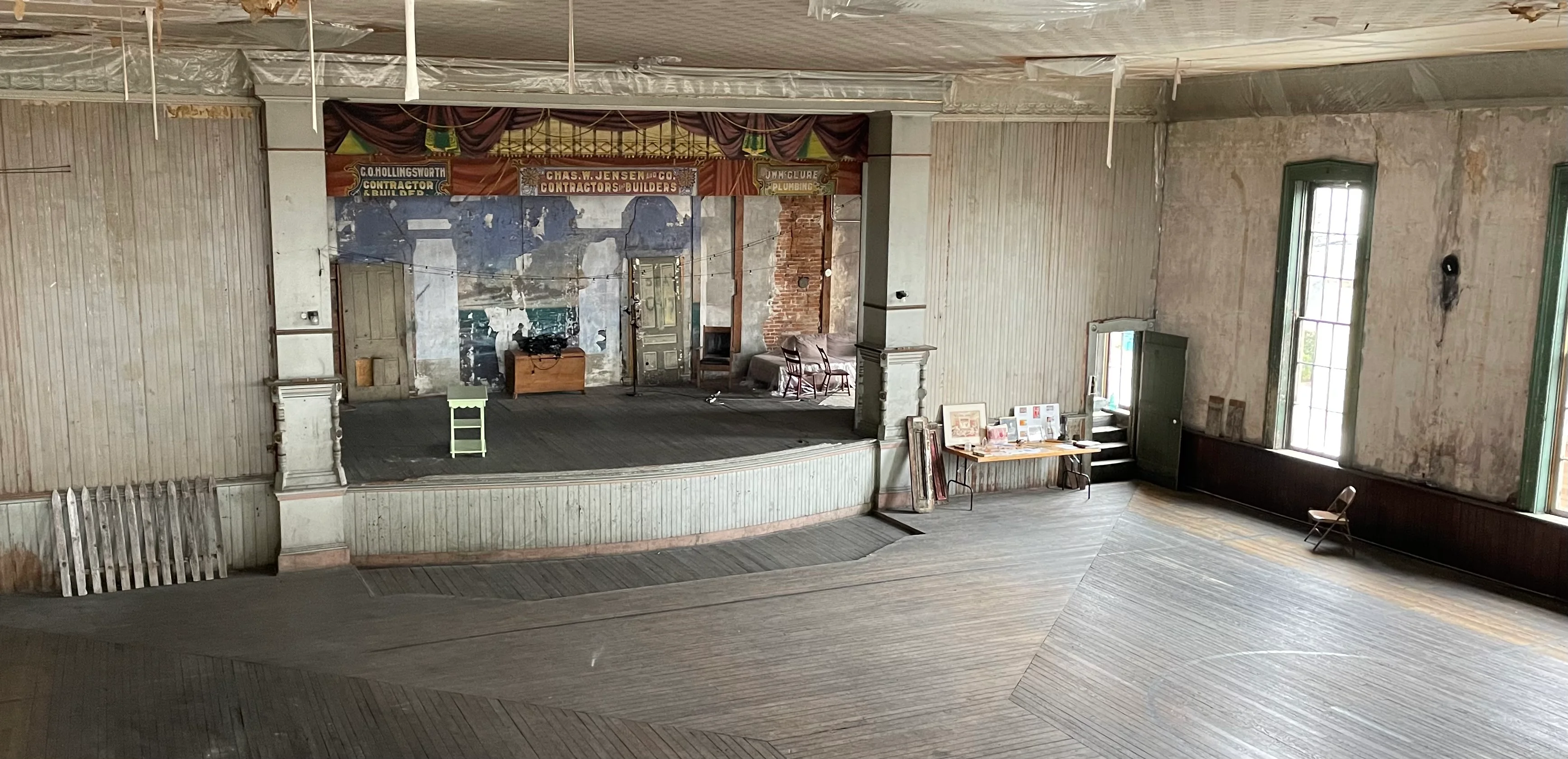 Historic theater interior with stage and wooden floor