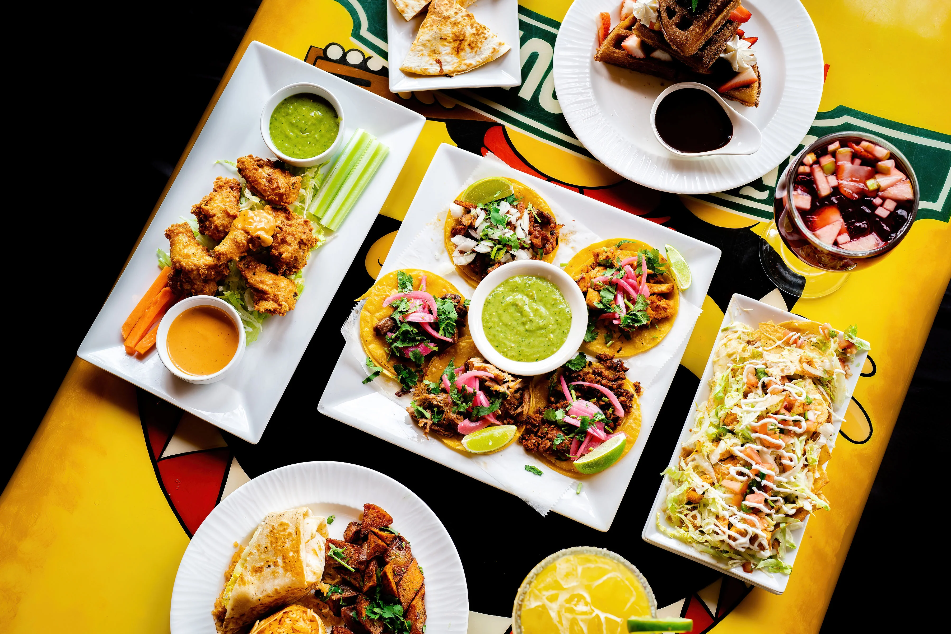 Colorful Mexican taco platter with salsas and sides