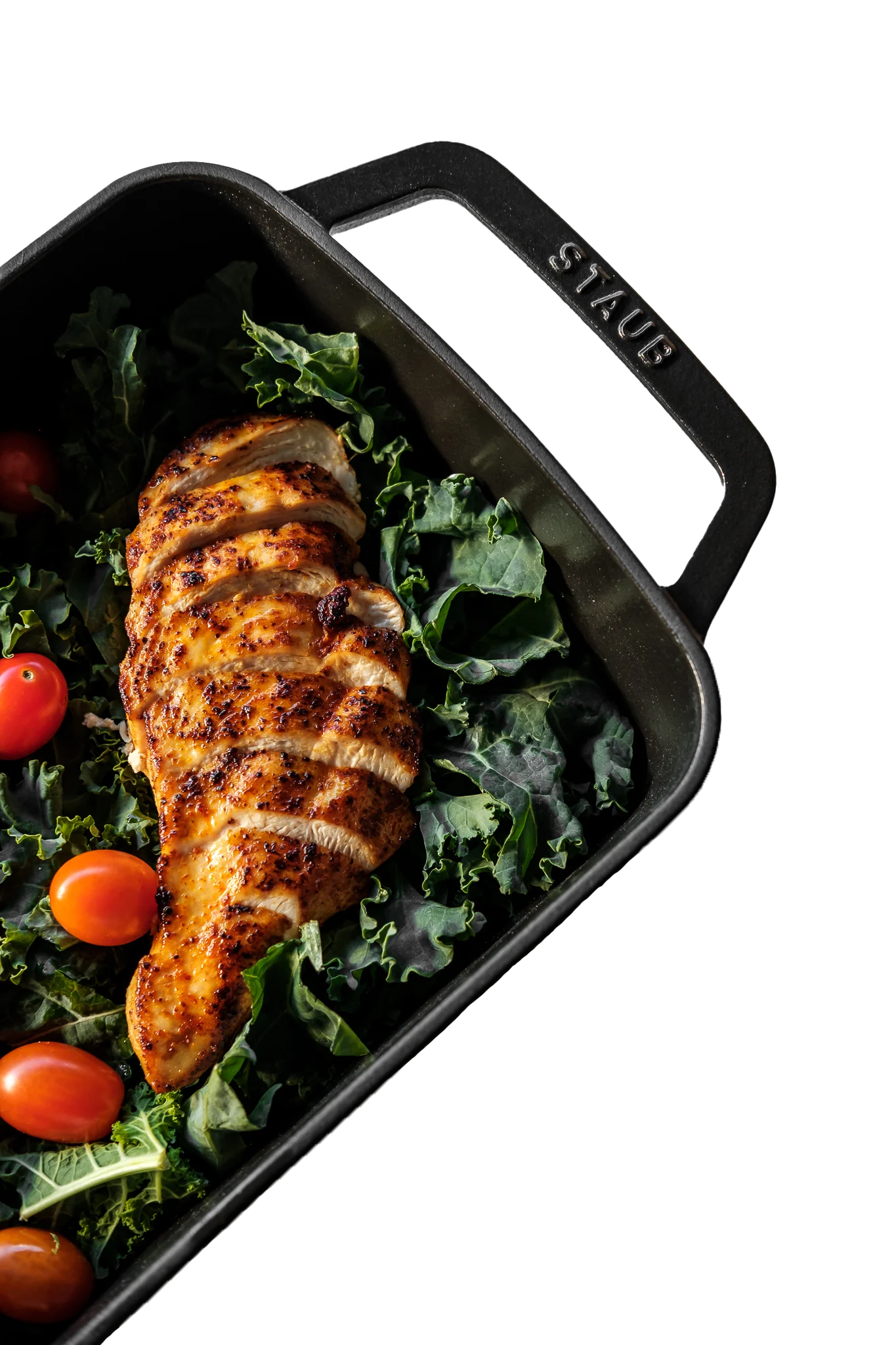 Grilled chicken breast on a bed of kale