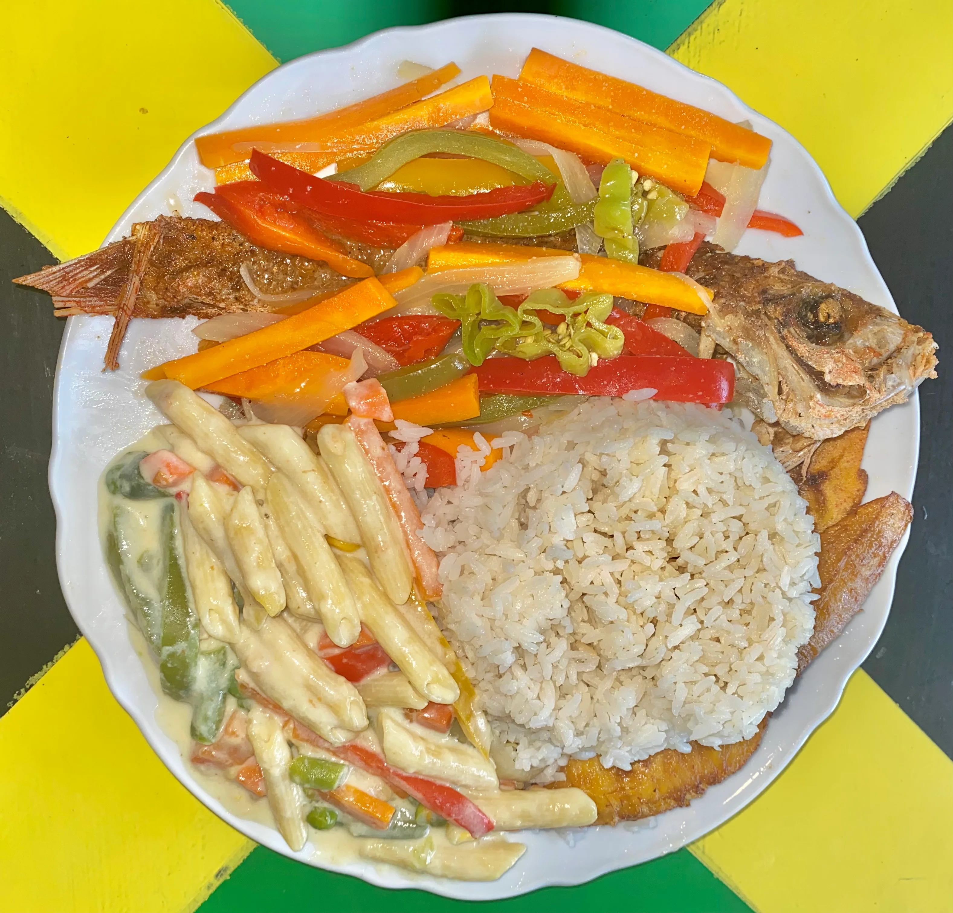 Jamaican escovitch fish with rice and vegetables