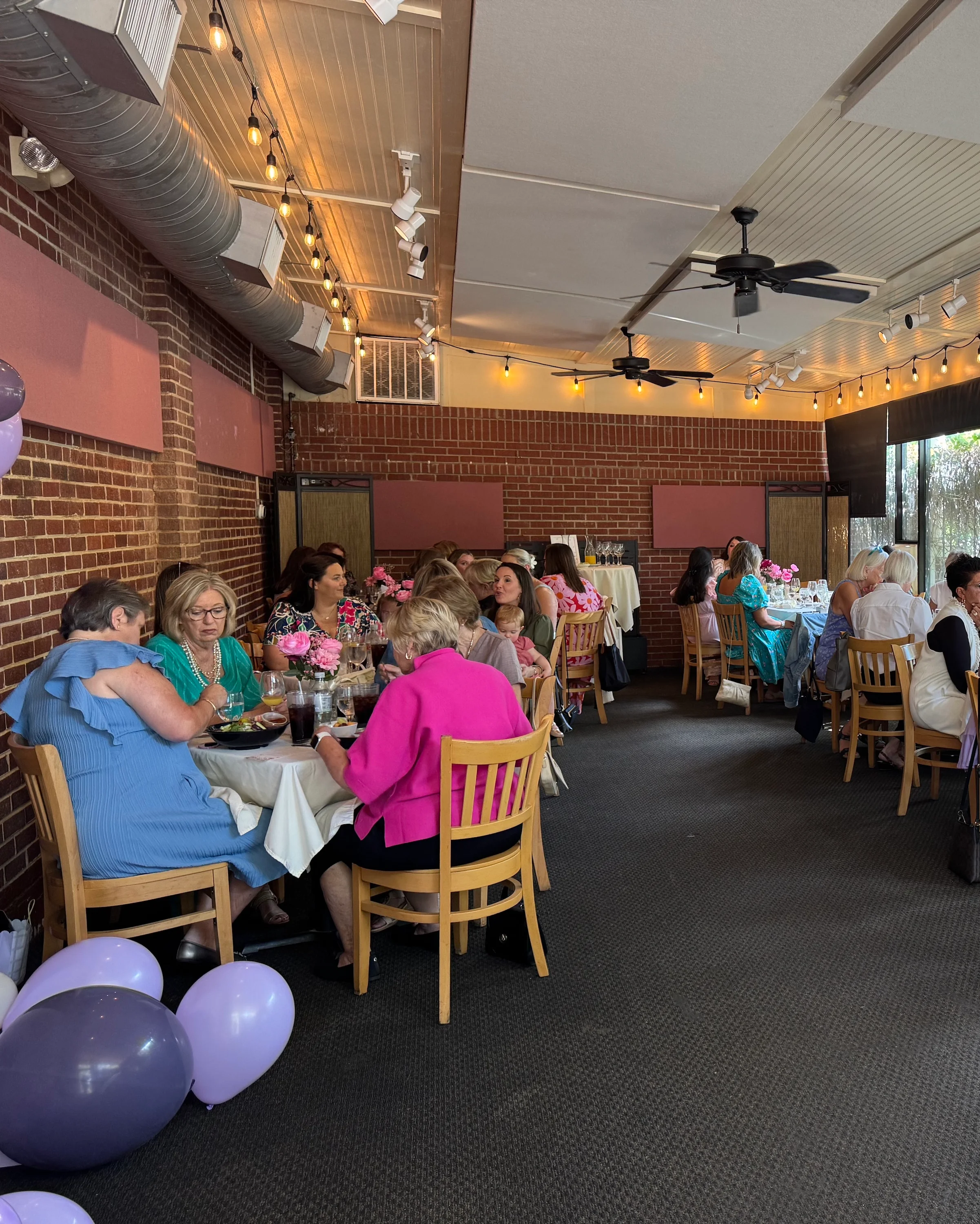 Elegant restaurant interior with guests enjoying a lively gathering