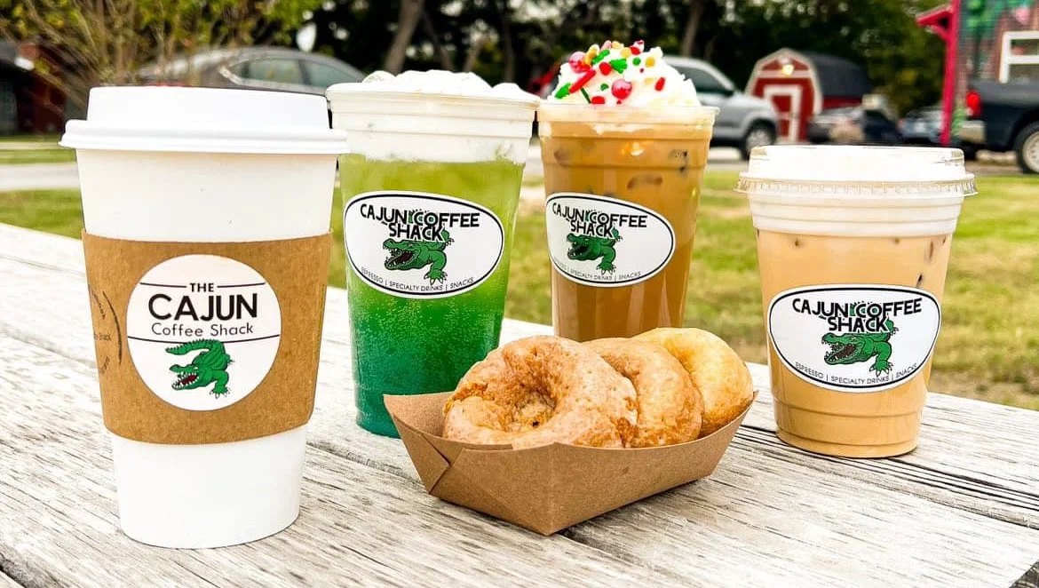 Assorted coffee drinks and donuts from a Cajun coffee shop