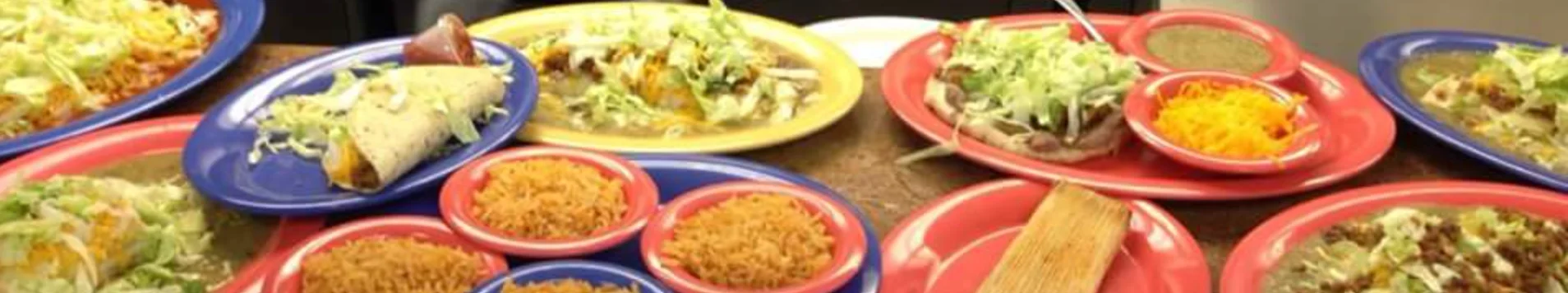 Colorful Mexican platter with tacos and rice