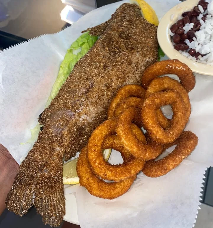 Crispy fried whole fish with onion rings