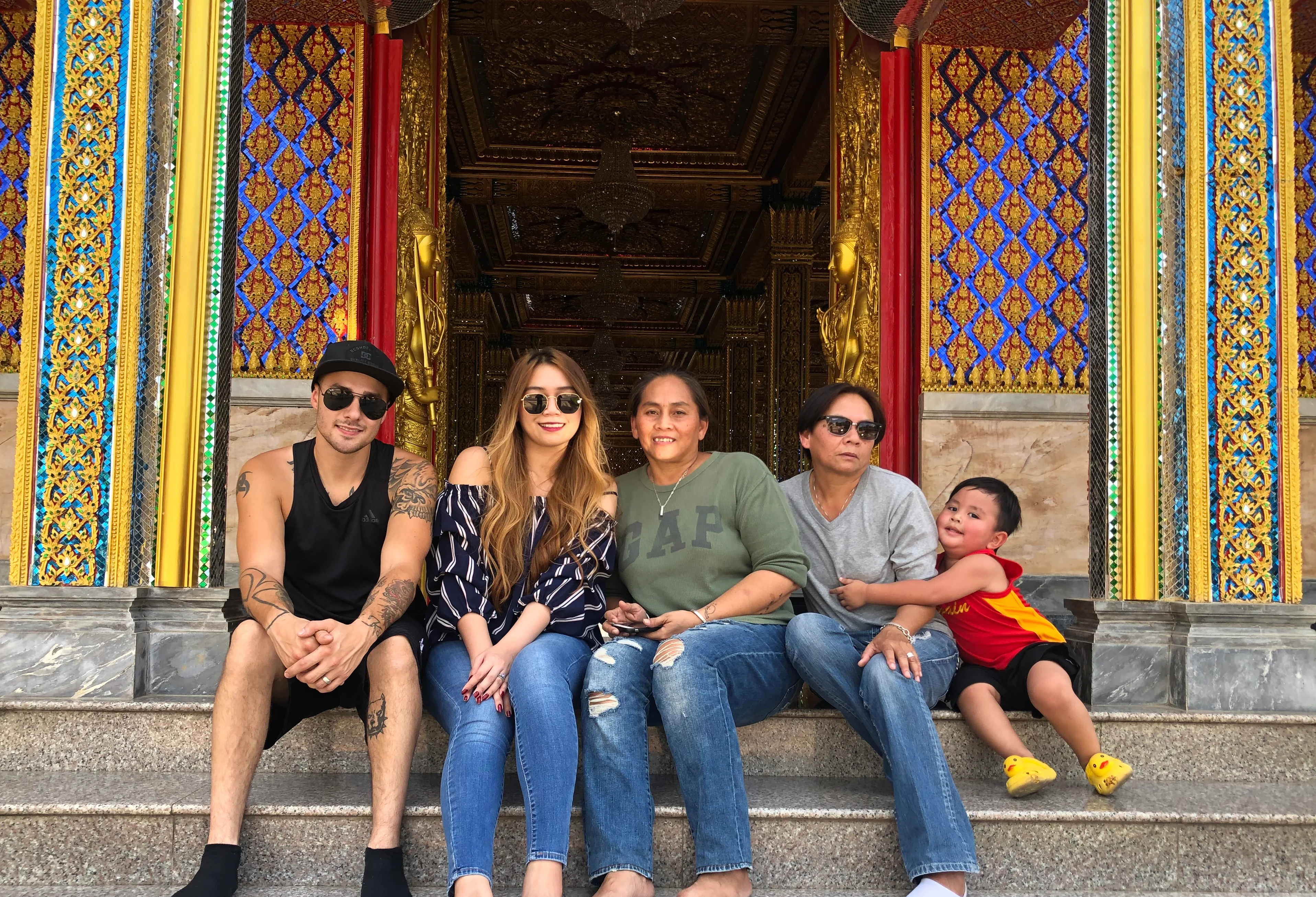 Family on steps of temple