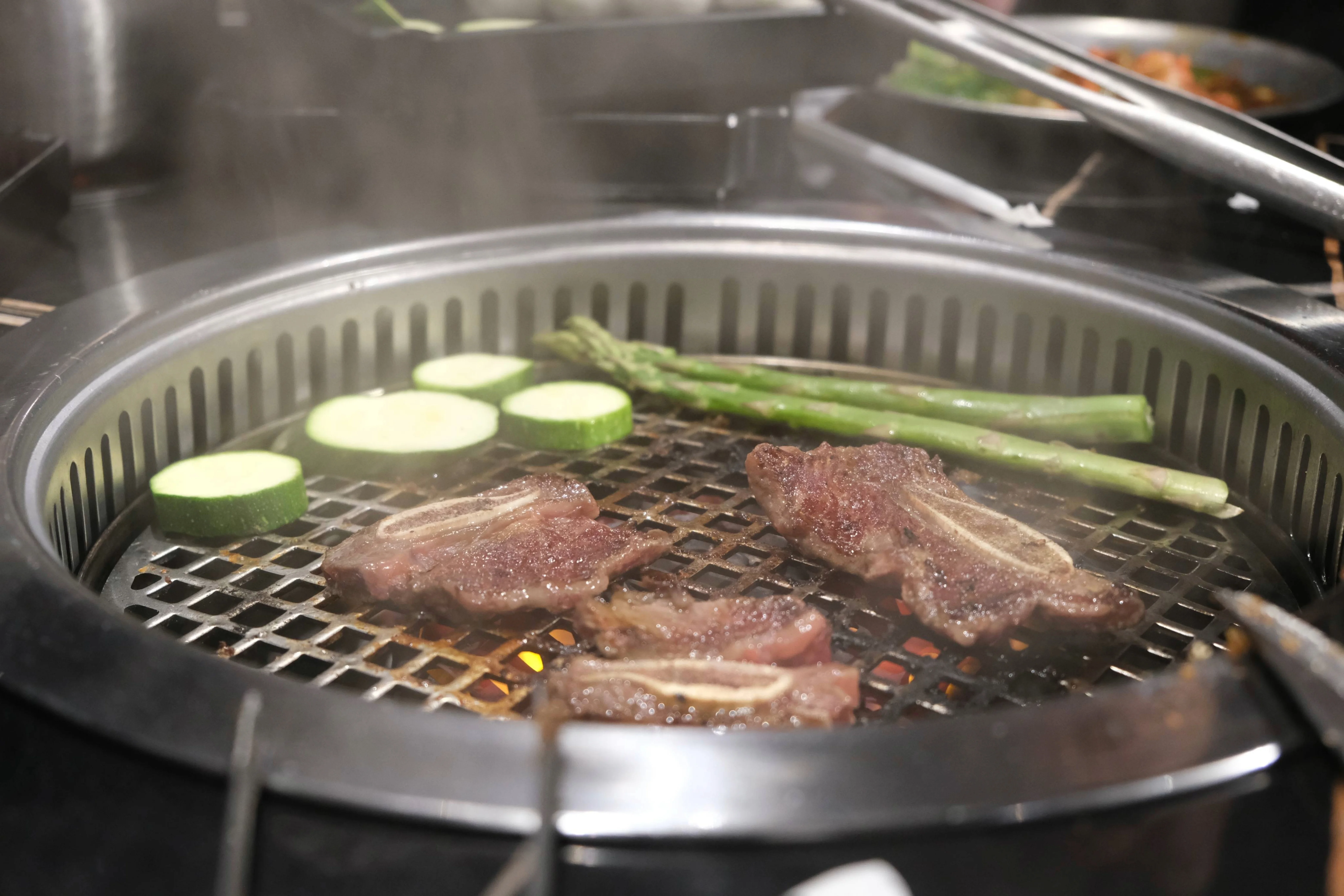 Korean barbecue with grilled beef on a charcoal grill