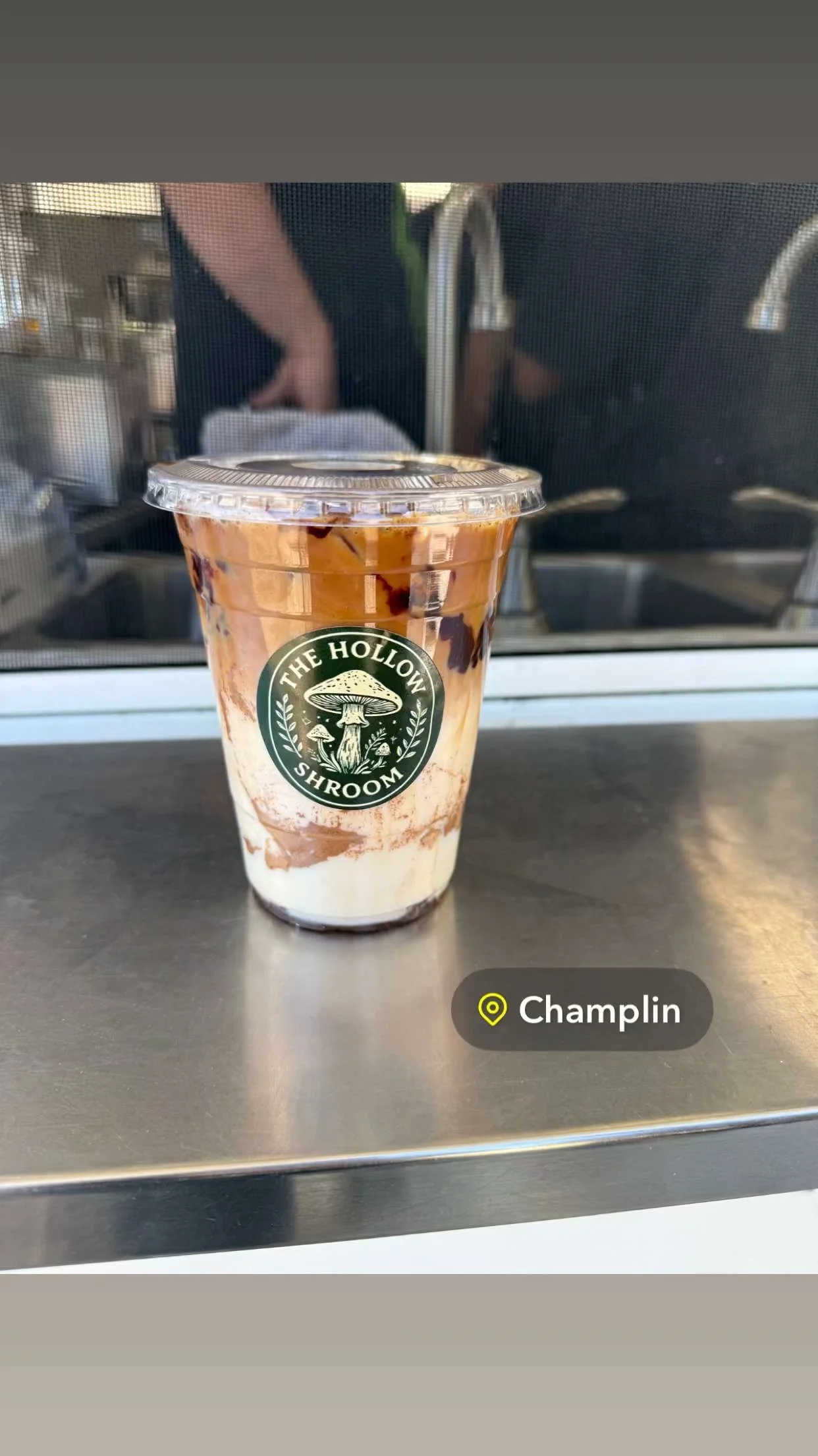 Iced coffee drink with layered chocolate and cream
