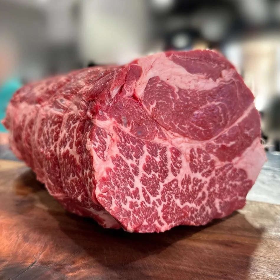 Premium marbled Wagyu beef cut on a wooden board