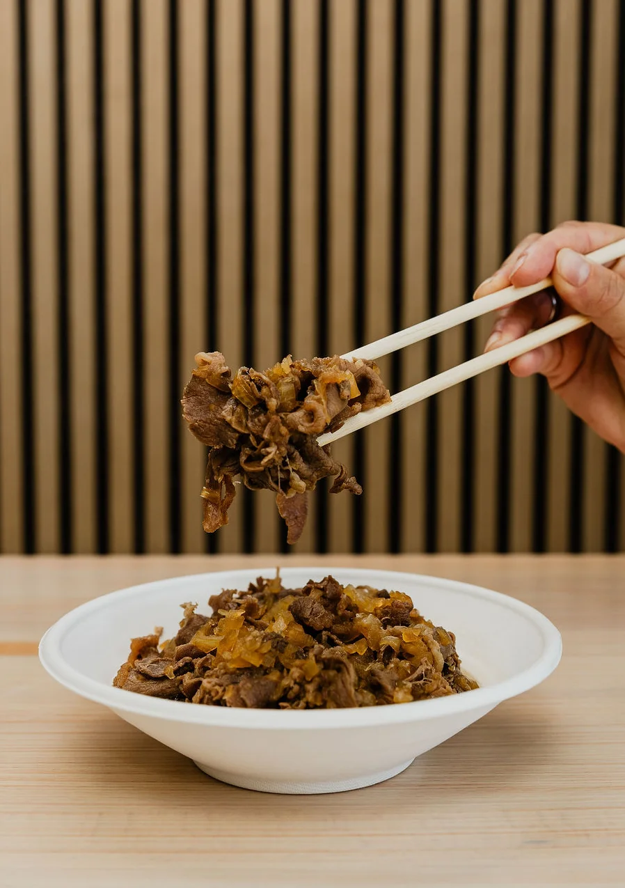 Bowl of Japanese shaved beef with a textured appearance.