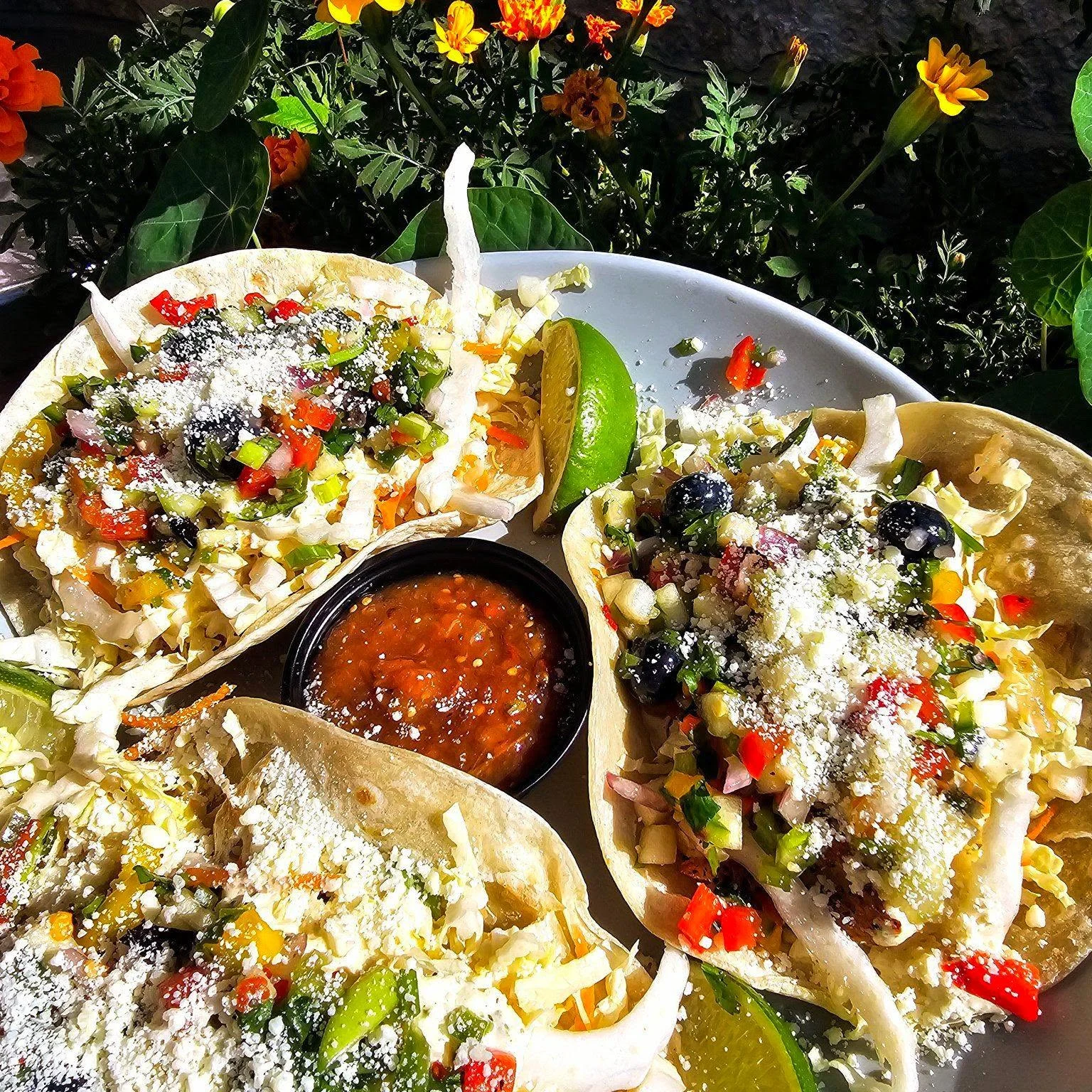 Colorful Mexican street tacos with fresh toppings