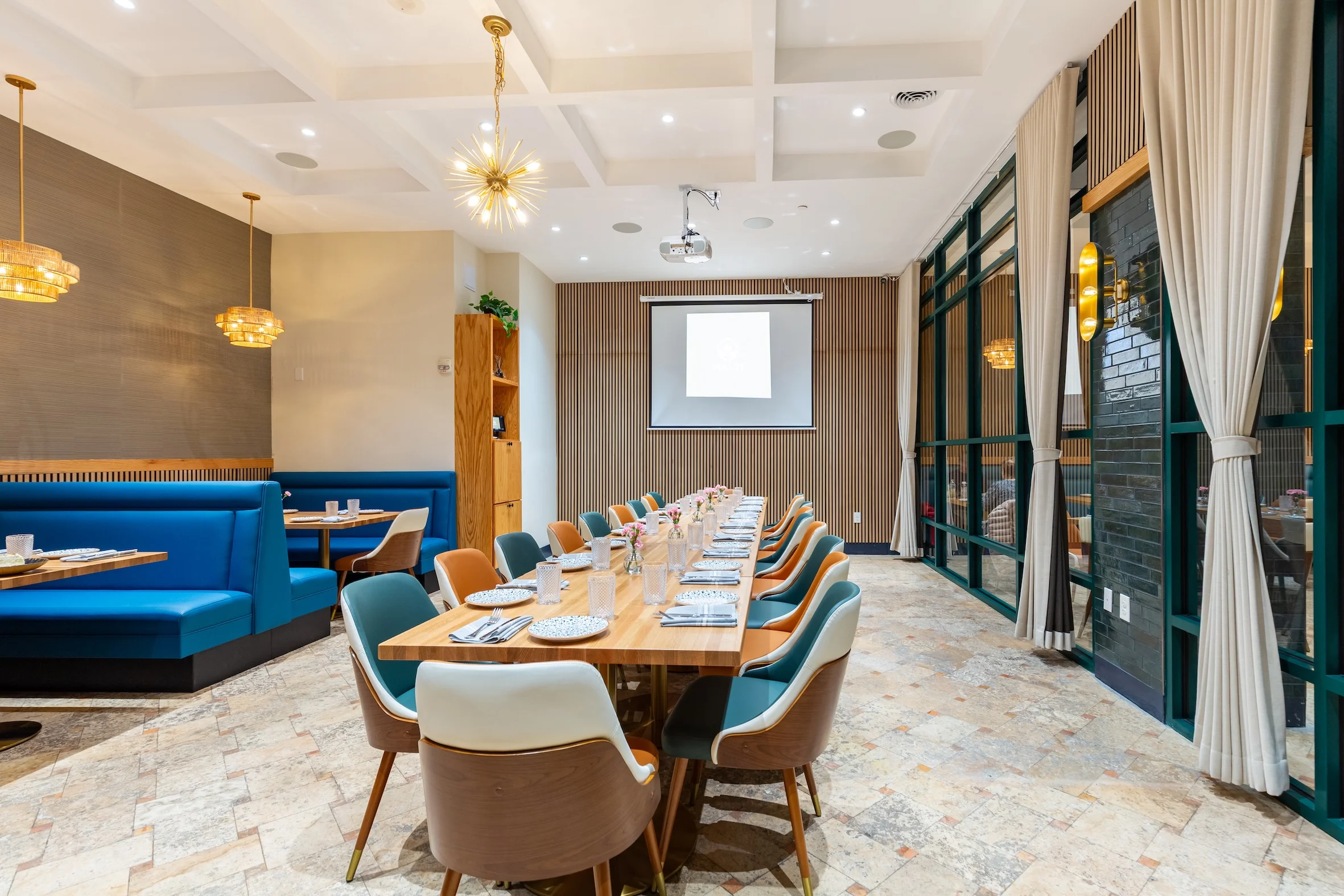 Elegant restaurant interior with long dining table and modern decor