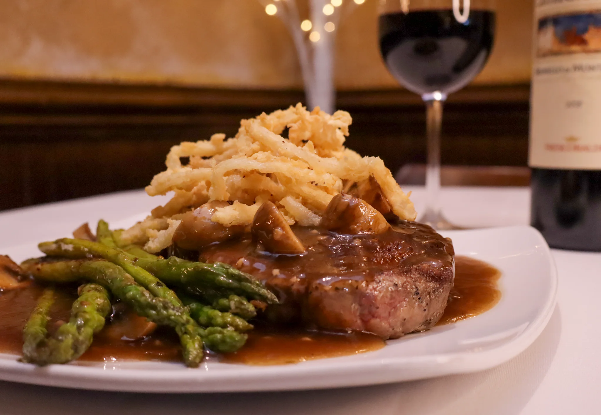 Ribeye in a creamy marasala sauce, topped with crispy onions and served with tender sautéed asparagus.