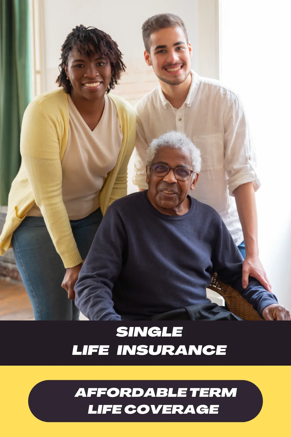 A group of three individuals, standing together with one person in a chair. They are smiling and appear to be family or close friends.