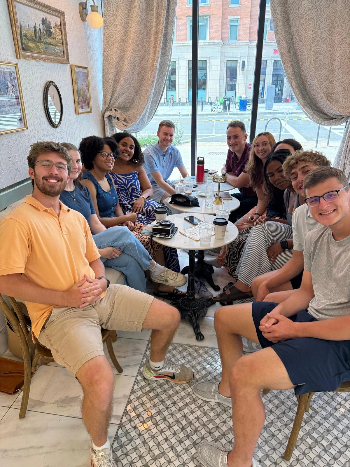 Group of friends enjoying coffee in a cozy café setting
