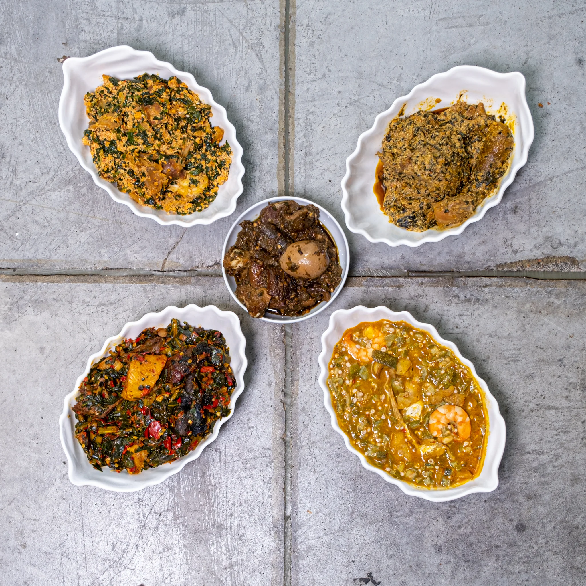 Nigerian assorted dishes served in traditional bowls