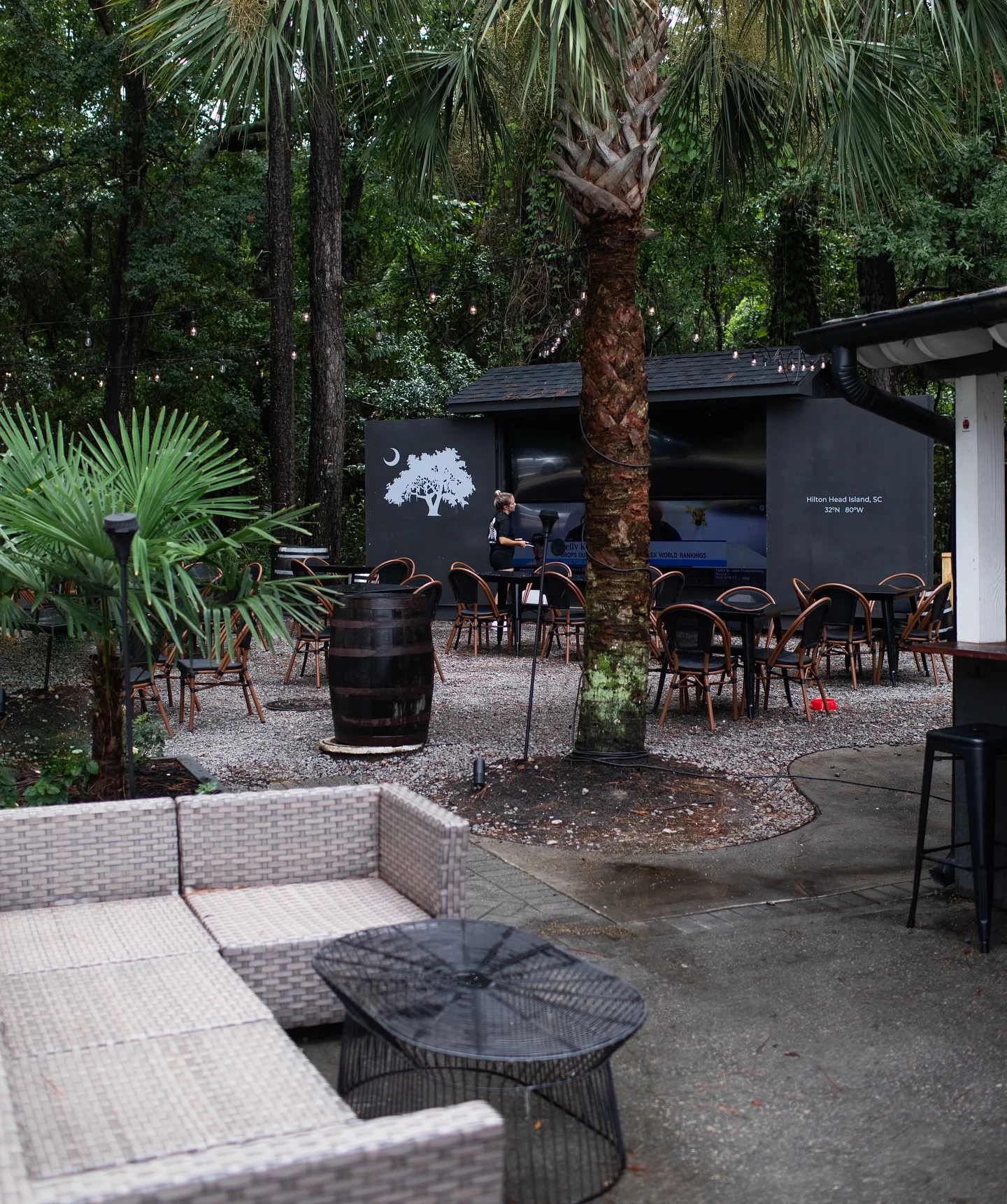 Outdoor dining area surrounded by lush greenery