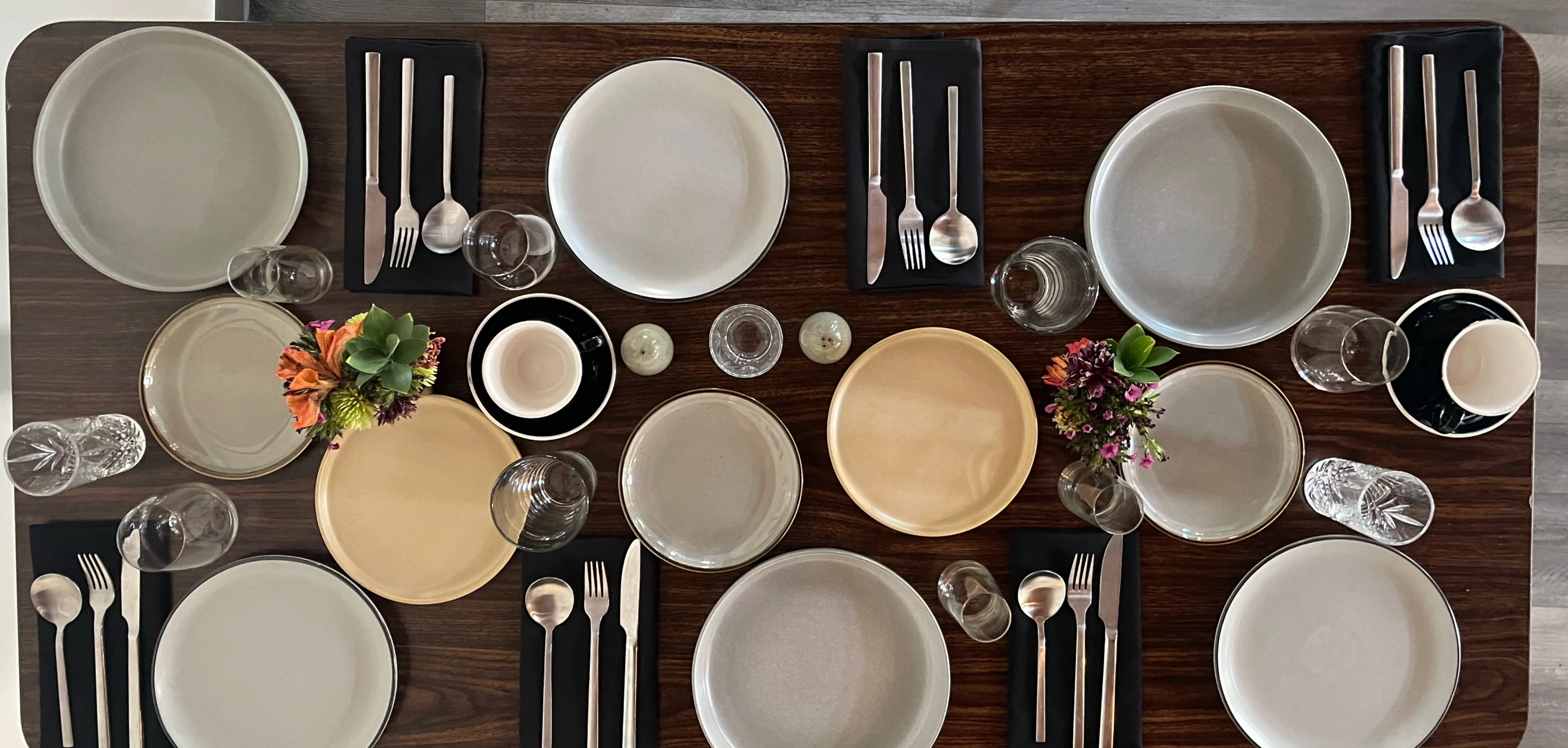 Elegant dining table set for a meal with plates and glassware