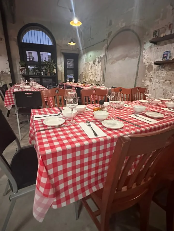 Cozy restaurant interior with checkered tablecloths and warm lighting