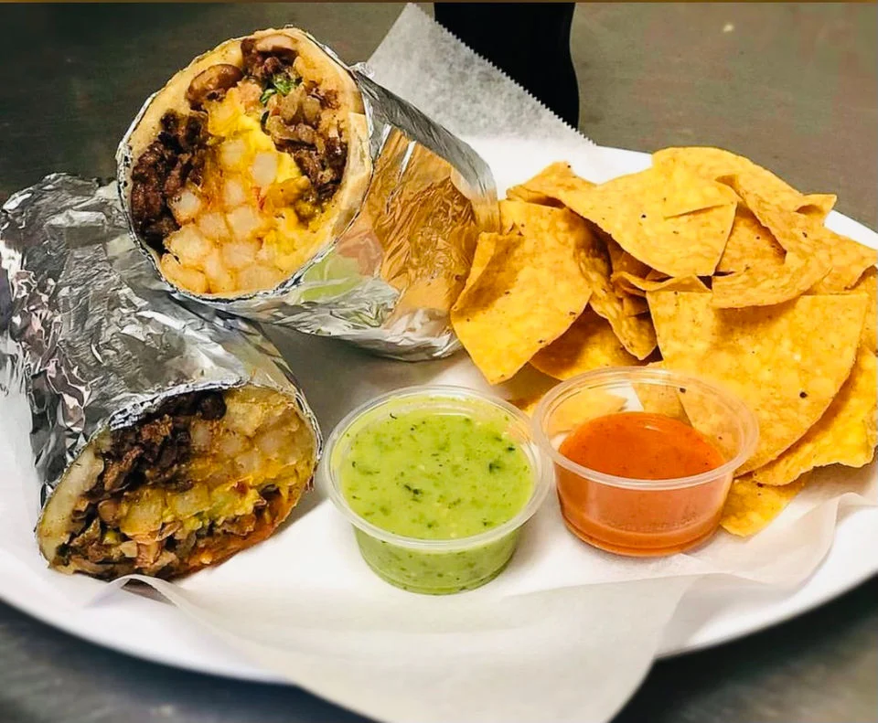 Delicious burritos with salsa and tortilla chips